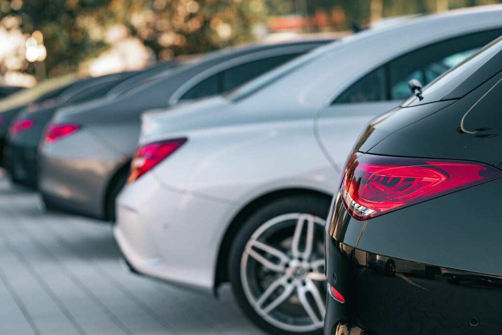 Selective focus view of different Mercedes-Benz cars parked in a row