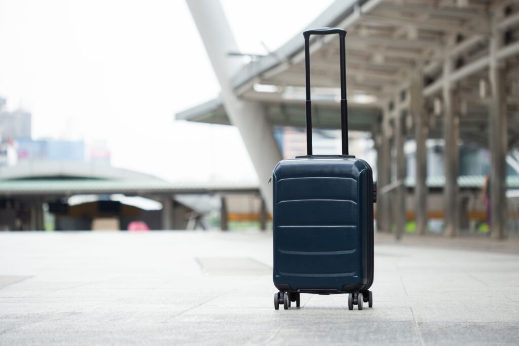 Single luggage on floor in city, baggage travel bage.